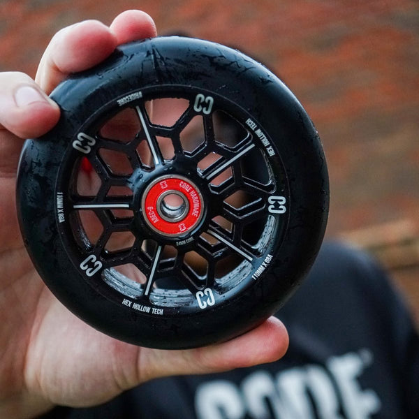 Core-Hex-Hollow-Stunt-Scooter-Wheel-110mm-Black-In-Hand